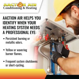 A technician in a hard hat and gloves working on a heating unit